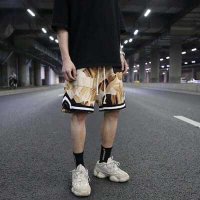 Shorts designed for athletes, featuring a floral pattern, perfect for workouts and beach outings.