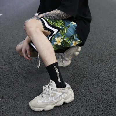 Shorts featuring a vibrant floral pattern, perfect for beach days and active lifestyles.